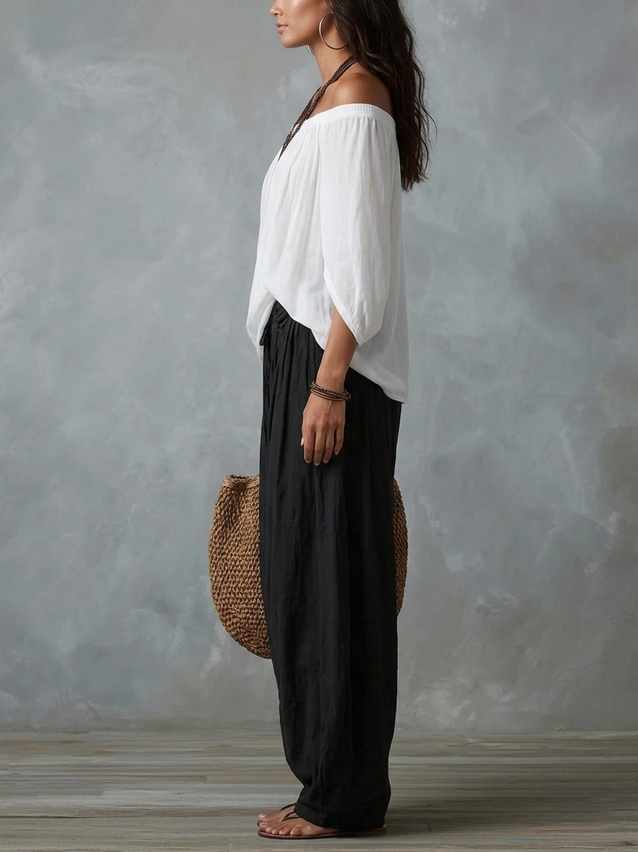 Mara | Ensemble composé d'un chemisier blanc à épaules dénudées et d'un pantalon palazzo noir